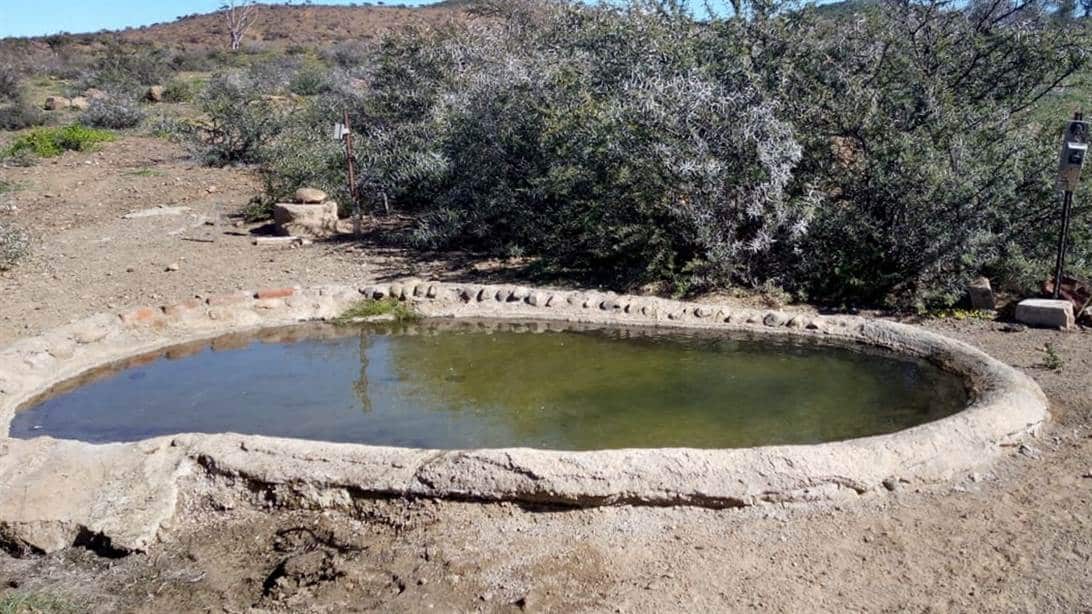 Water reservoir lying deep beneath the surface.